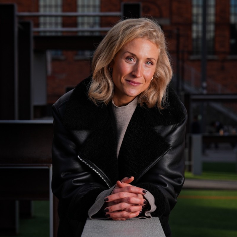 Woman sitting down posing